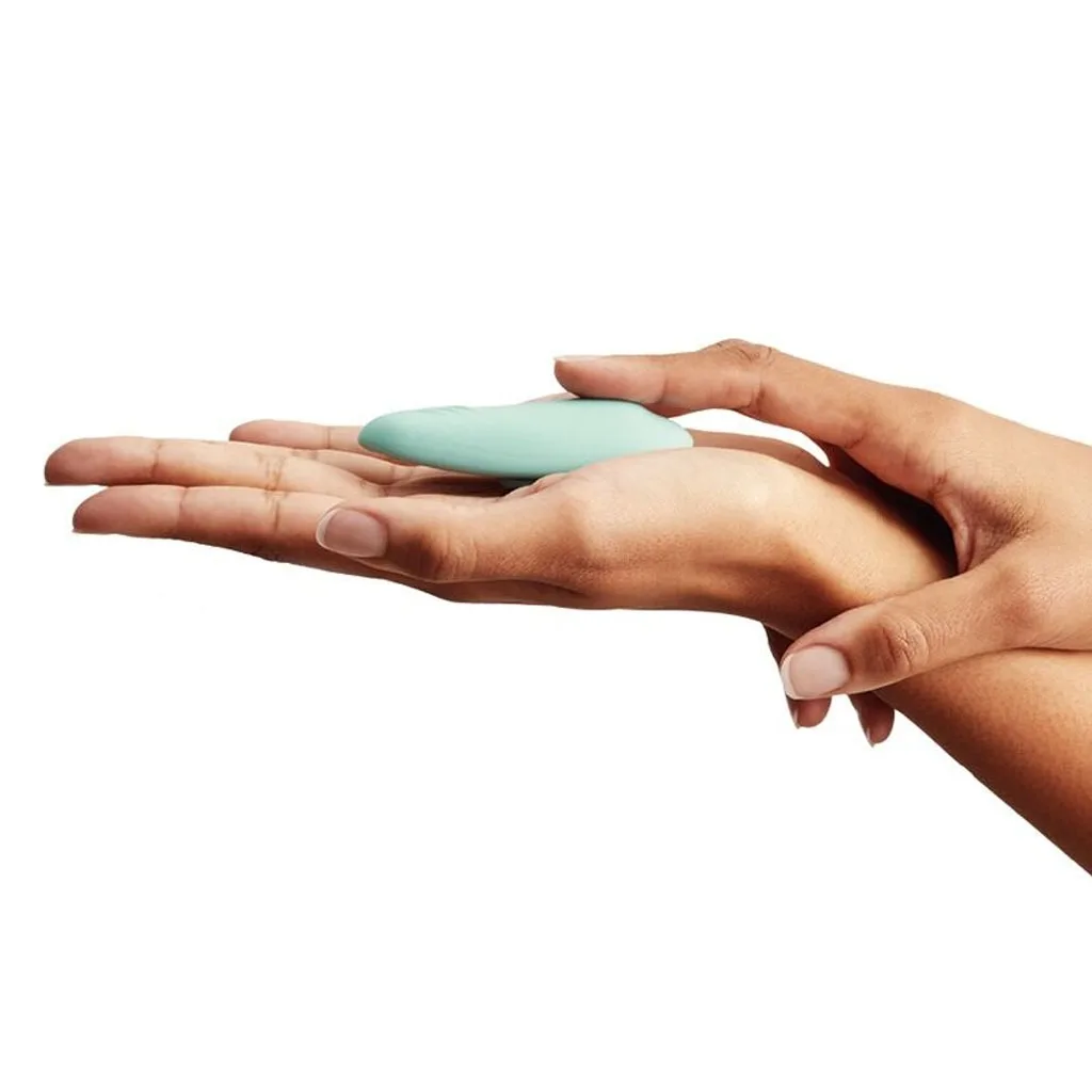 we-vibe moxie + slip vibrator in hand