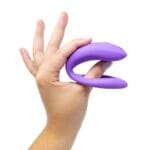 We-Vibe Sync o koppel toy in hand